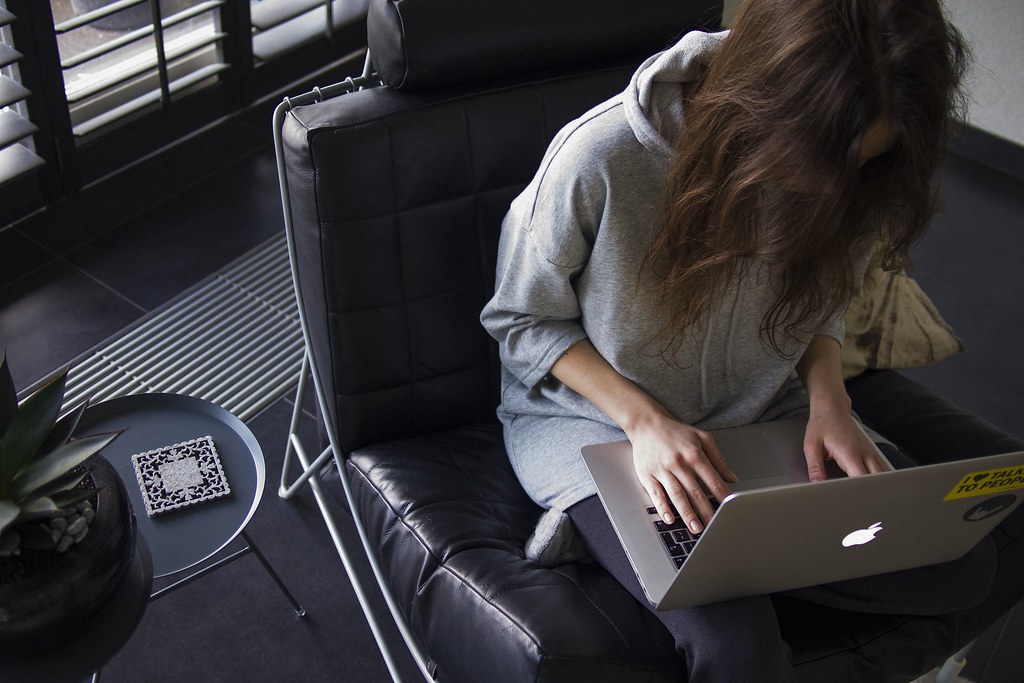 Woman Sitting with Laptop on a Chair - Credit to https://bestpicko.com/