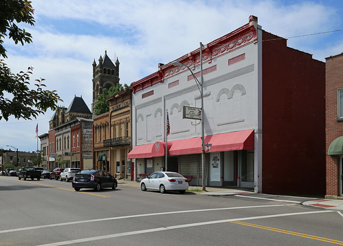 perrycounty ohio newlexington historic building structure commercial twostory altered remodeled romanesque brick painted boarded windows roundarched cornice garlands swags storefronts sidewalk street cars foe fraternalorderoftheeagles awning