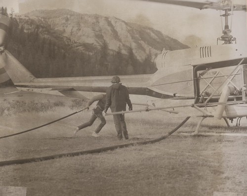 1974. Loading spray helicopter with insecticide at heliport. OR/WA/ID Douglas-fir tussock moth control project. | by USDA Forest Service