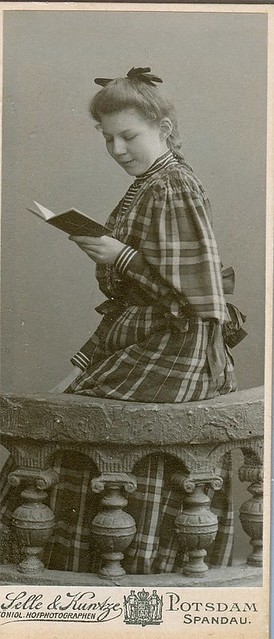 Slender girl reads a book cdv