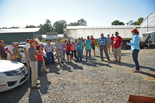 Extension specialist Dr. Angela Post (right) speaks to agents and directors during a tour of Broadway Hemp's green houses and farms.