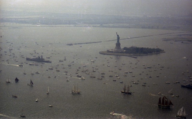 In late afternoon, the sky began to turn a threatening grayish green color as massive thunderstorms slowly worked their way toward Jersey City, New York Harbor, the Statue of Liberty and the armada of Tall Ships celebrating the Bicentennial. July 4 1976