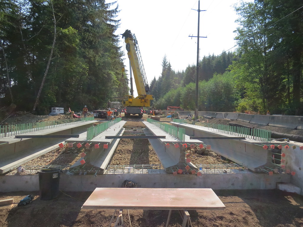 Construction continues on SR 112  as crews work to construct a fish passable structure under the highway. Traffic is on the one lane detour and controlled by a temporary signal through fall.