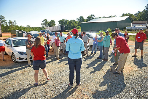 Extension specialist Dr. Angela Post (center) speaks to agents and directors during a tour of Broadway Hemp's green houses and farms.