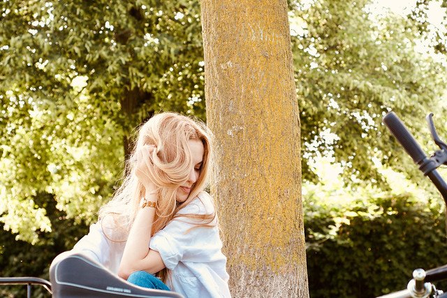 Beautiful young model relaxing in park, outdoor space, during summer days