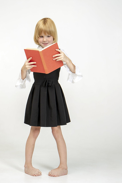 Young girl schoolgirl with book