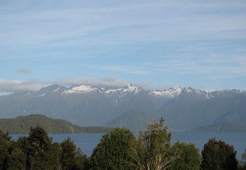trees newzealand lake snow mountains water clouds honeymoon motel southisland manapouri lakemanapouri
