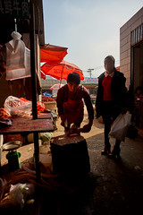 Butcher cutting meat - Yunnan, China