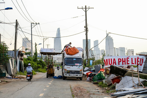 road city skyline cityscape dystopian future past poor rich asia southeast vietnam saigon hochiminh dirty wire cable scooter recycle center vietnamese downtown
