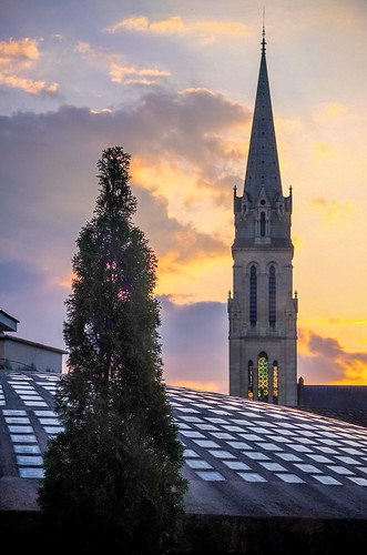 Bergerac: Terrace Sunset by Patrick and Mary Jo, From our terrace, we watched the sun set behind the spire of Église Notre Dame as the rosy sky indic