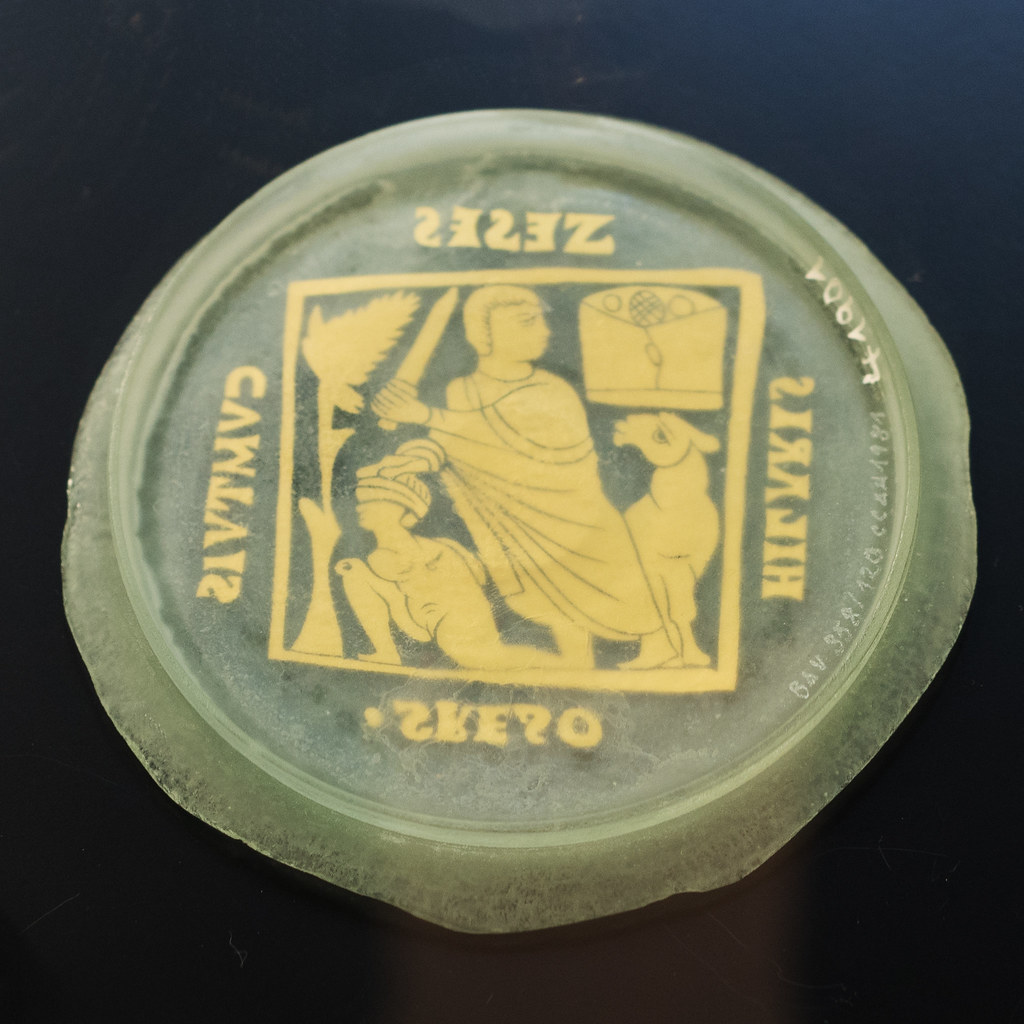 Roman glass vessel base with gold-leaf scene representing Abraham about to sacrifice his son (replica)