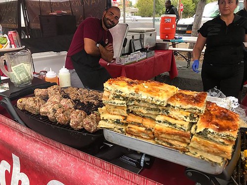 #kvpinmybelly Spanakopita and meat patties on the grill at Hillcrest Farmers Market. NOM!