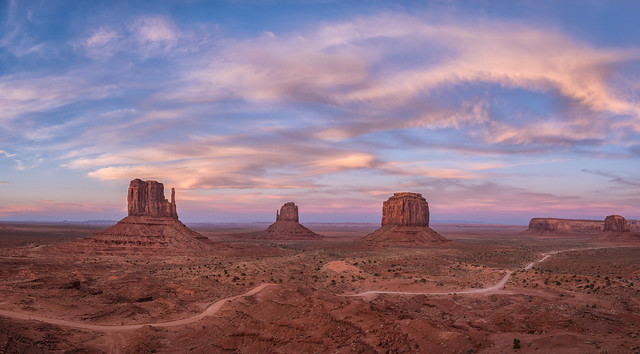 Panorama of sunset over the West and East Mittens Buttes in Monument Valley Navajo Tribal Park on the Arizona / Utah border