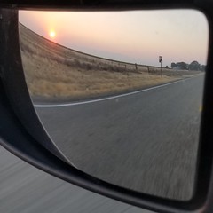 Smokey sunrise in the rearview