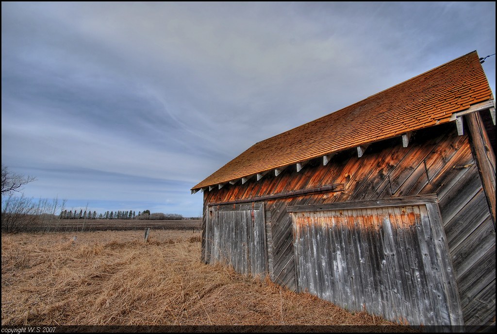 The barn with the orange roof by A guy with A camera
