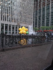 Big inflatable flower on a fountain in front of the Exxon building