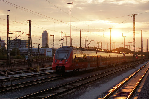 german railways db deutsche bahn bundesbahn sunrise glint nurnburg sb train electric multiple unit sun rise track wires 442 726