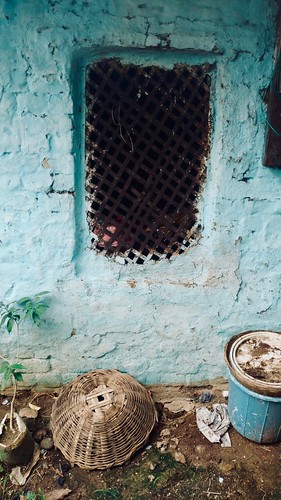 window wall architecture rural mud chhattisgarh india house blue brown grill metal bamboo basket