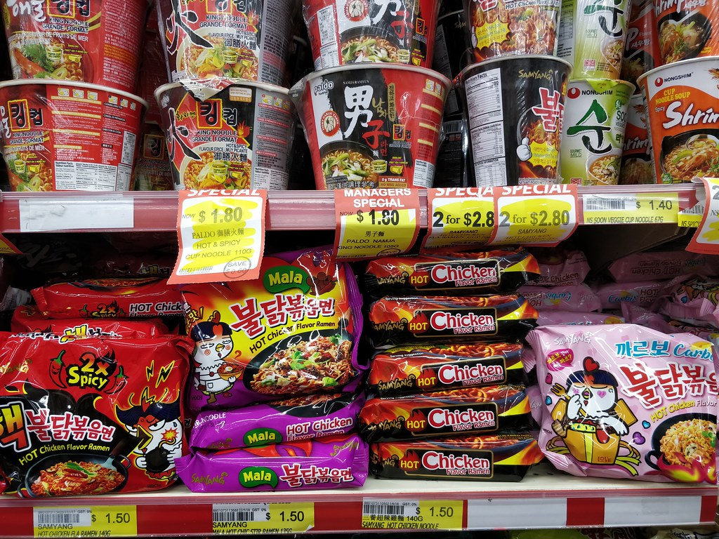 Instant Packets of Ramen Noodles in a shelf of a store 