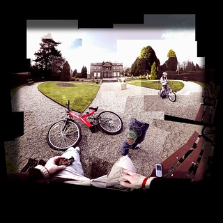 tired from learning to ride her bike, we stopped to eat a mars bar, check the tamogatchi and take a rest.