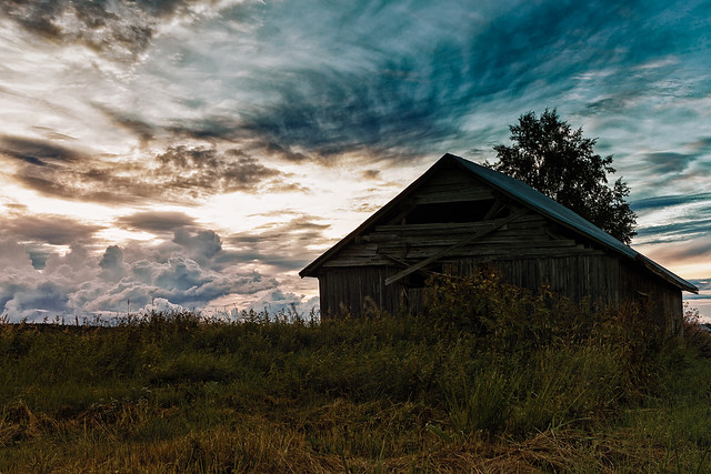 Barn House Under The Dramatic Clouds