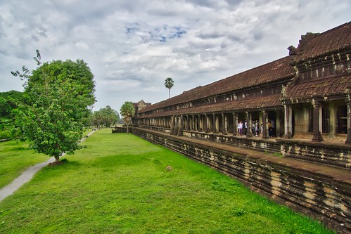 angkor wat angkorwat temple ruins architecture gallery terrace naga archeological park archeology history historical ancient culture religion religious grey sky clouds green grass siem reap siemreap cambodia southeast asia sony alpha 77 slt dslr