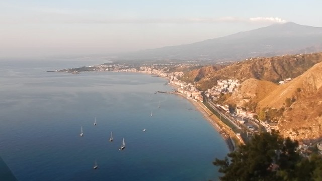 VIDEO: Panorama of Sicilian Coast from Taormina to Giardini Naxos with Mount Etna in the background.