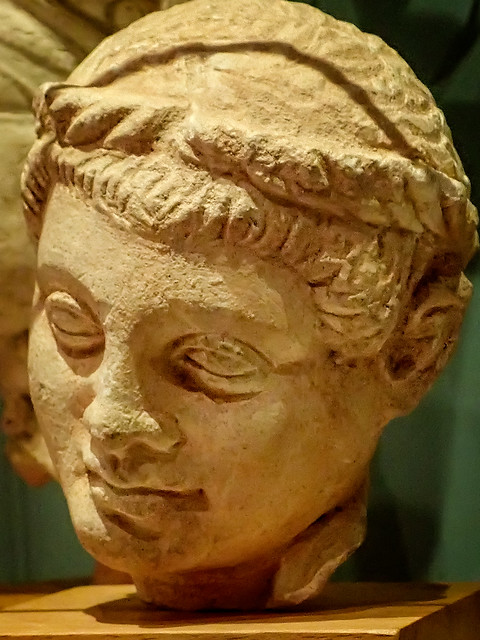 Funerary sculpture of a boy's head strongly influence by Hellenistic Greek style Cyprus 400-200 BCE