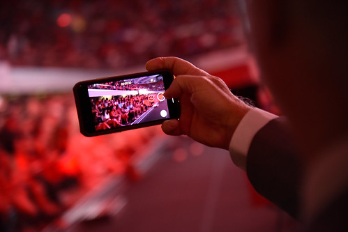 Vice Chancellor Mike Mullen takes a video on his phone during Convocation.
