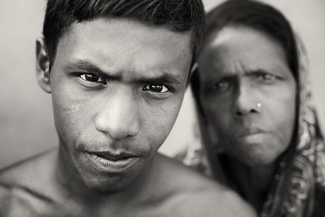 Bangladesh, young rickshaw driver and his mother