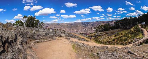 travel peru andes cusco mountains mountainside landscape sky cloud tree quenco ruins ancient stone road