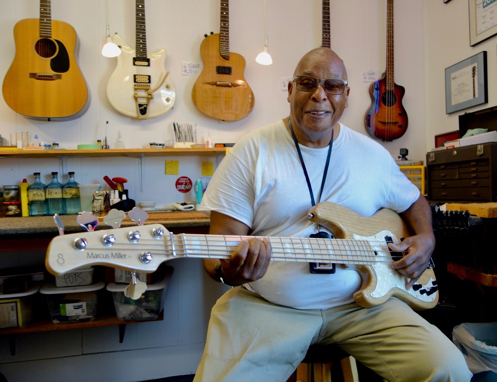 Big John Howard picking up his new lefty Fender Marcus Miller Bass after having me set it up righty.....so very cool,