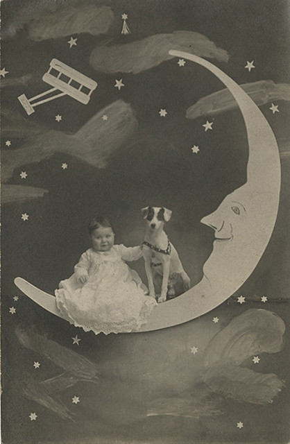 Baby and Dog on a Paper Moon