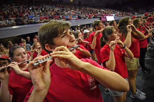 Members of the marching band play during Convocation in Reynolds Coliseum.
