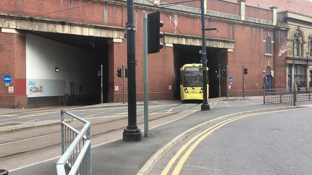 VIDEO == Manchester -- Metro Tram coming out of the Tunnel at Piccadilly Railway Station onto London Road