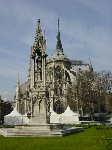 Cathedrale Notre-Dame de Paris in France. There are sharp, stone decorations that surround the structure. 