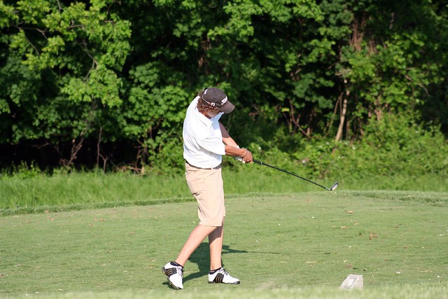 Aaron playing in high school golf tournament