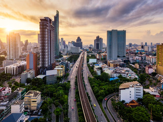 Aerial view of Bangkok skyline panorama and skyscraper with light trails on Sathorn Road center of business in Bangkok city Thailand.