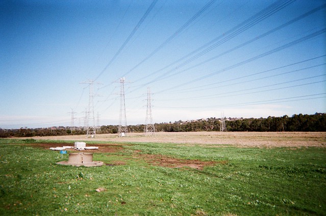 Power lines pylons on sunny day