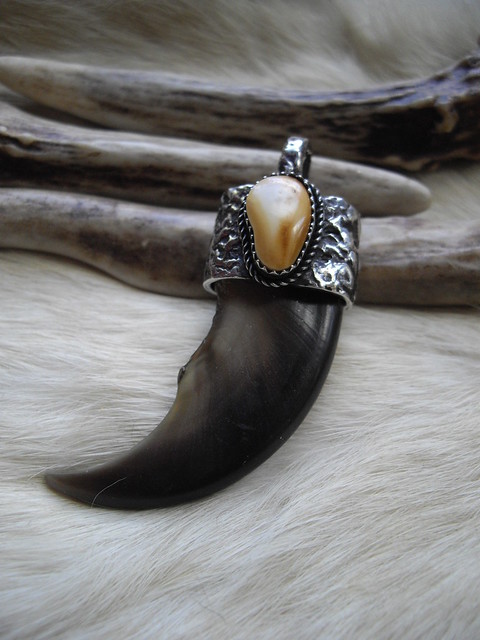 Bear claw and elk ivory pendant