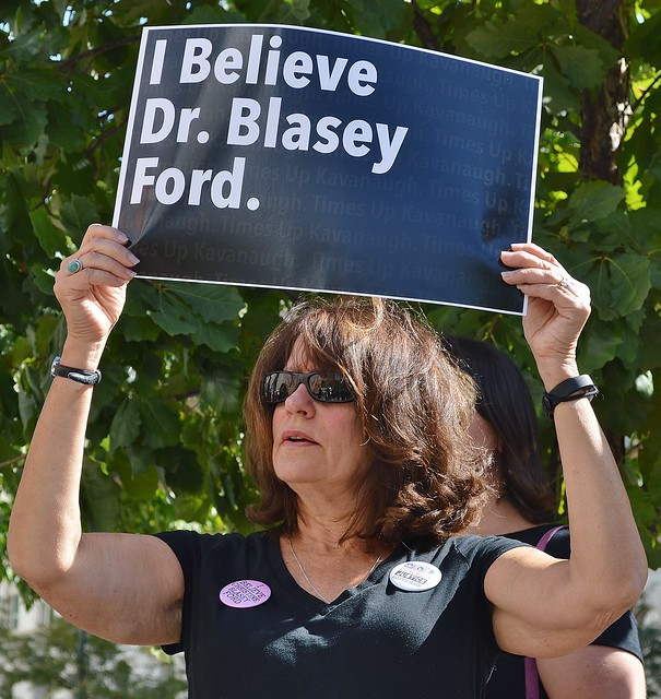 This woman was among the crowd at a rally outside the office of Colorado Senator Cory Gardner, calling on him to oppose the nomination of Brett Kavanaugh to the US Supreme Court.