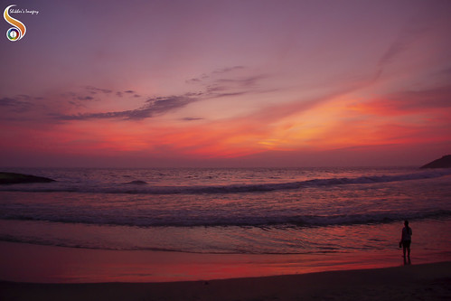 kerela kovalam beach shore waves horizon sunset sun sky radiance clouds sand amber lady woman costal coast seashore shikhersimagery