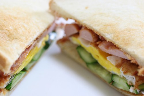 Lunch sandwich with chicken, egg, and cucumber
