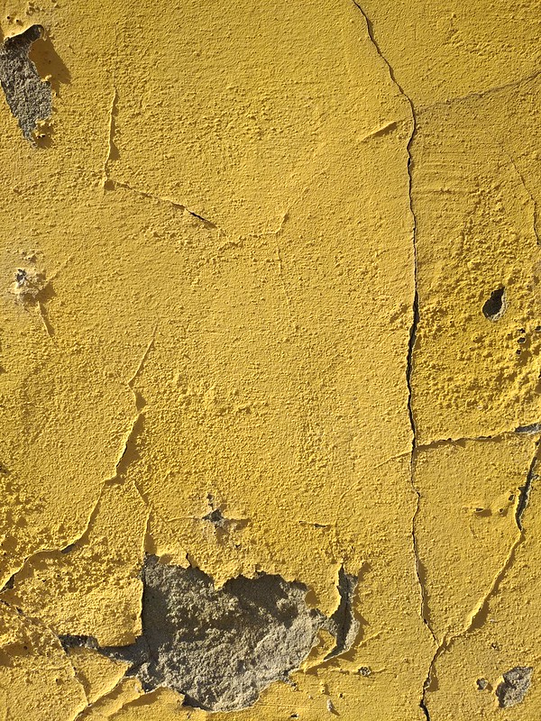Cracked yellow wall texture