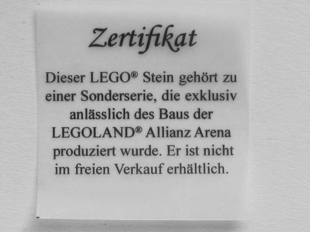 Box with Lego Allianz Arena brick, soccer ball and certificate / Legoland Günzburg