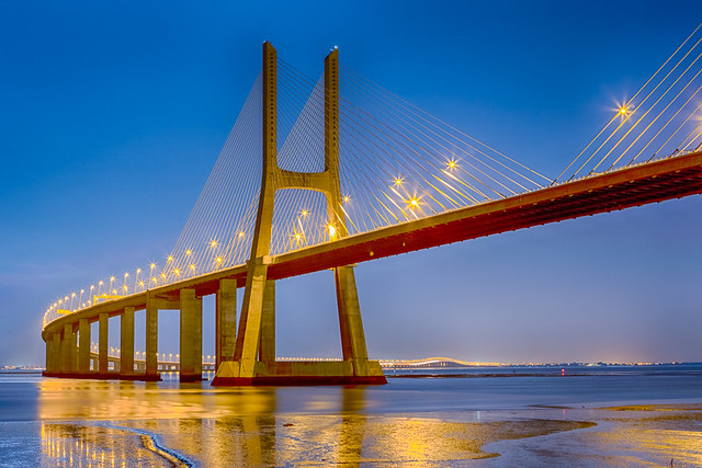 Famous and Renowned Picturesque Vasco Da Gama Bridge in Lisbon in Portugal. Picture Made During Blue Hour.