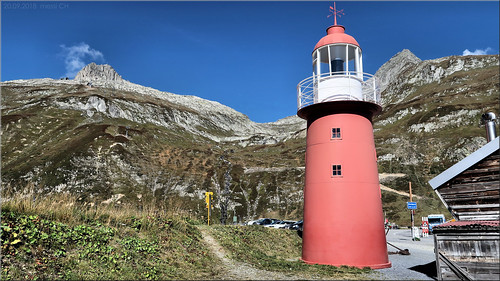 oberalppass lighthouse leuchtturm switzerland mountains vierquellenweg hiking nature water rot red