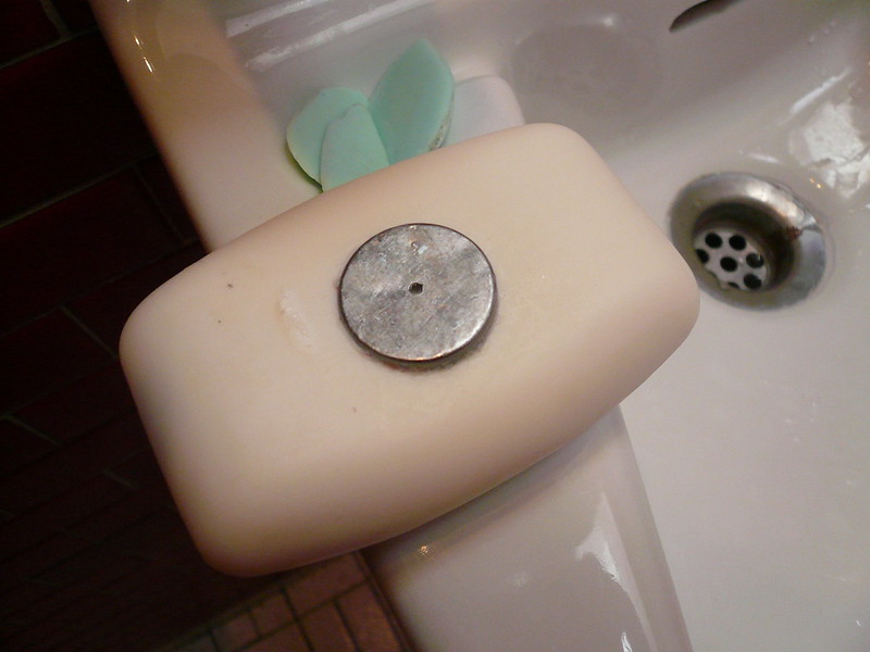The soap, it is attached to a magnet!