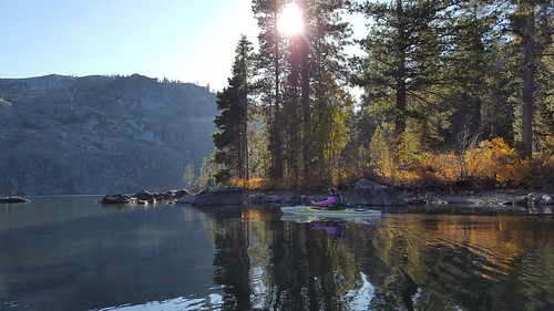 castlelake kayaking water reflection pines sun nature scenic paddling fall rocks