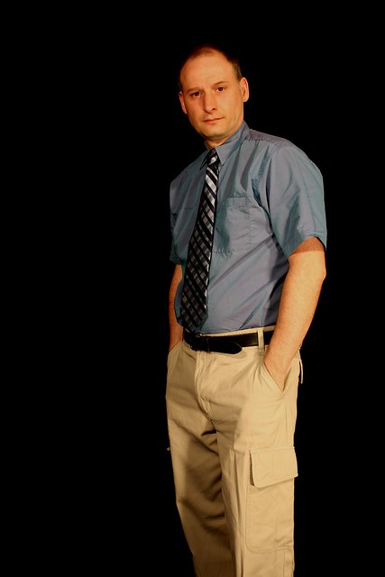 Man posing in shirt and tie